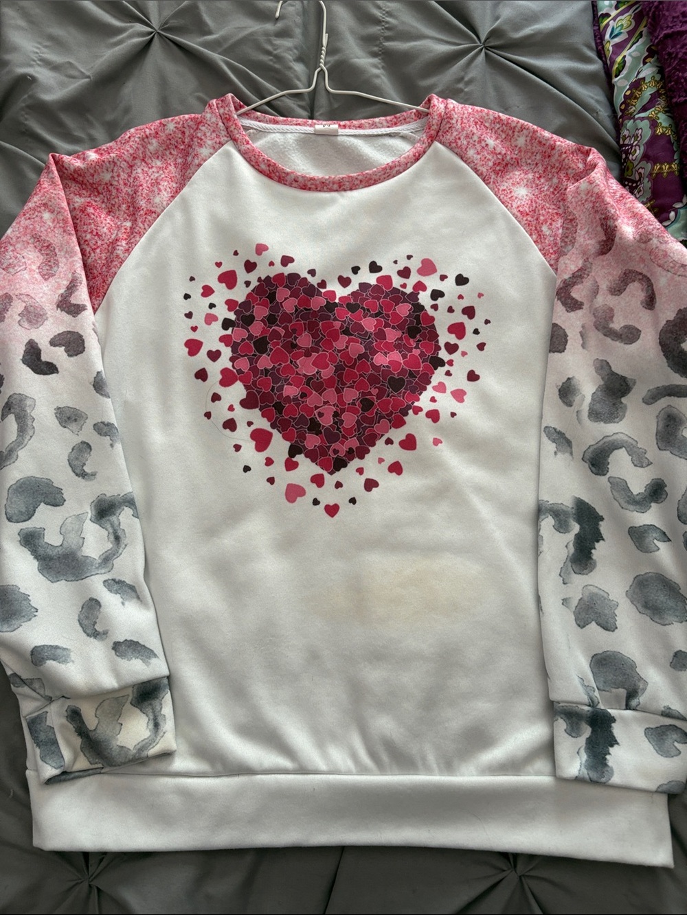Woman’s White Pullover Sweatshirt with Pink Heart Graphic